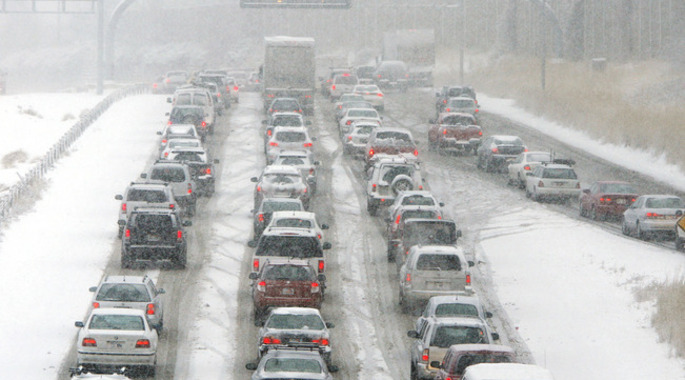 Commuters on Interstate 215 near Parleys Canyon sit in stalled traffic during the morning snow storm in Salt Lake County, Tuesday, Dec. 8, 2009. The Utah Highway Patrol said there were 76 accidents involving property damage in Salt Lake and Utah counties between midnight and 10 a.m. The storm is very similar to those that kicked off the winter season in 2008 and 2007 in the second week of December and lasted for several weeks. (AP Photo/Deseret News, Jeffrey D. Allred) SALT LAKE TRIBUNE OUT. PROVO DAILY HEARD OUT. MAGS OUT. NO SALES.